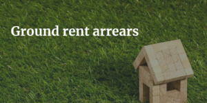 Ground rent arrears solicitoprs. Image of house & grass